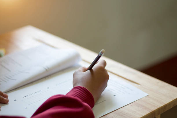 istock Students in uniform are doing the test in the classroom 1235057480