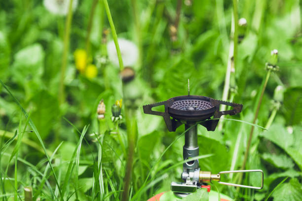 istock Tourist burner on a gas cylinder in the grass. 1235060762