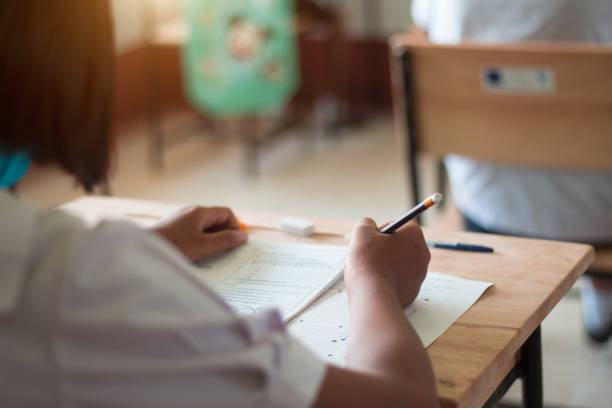 istock Students in uniform are doing the test in the classroom. 1235067332