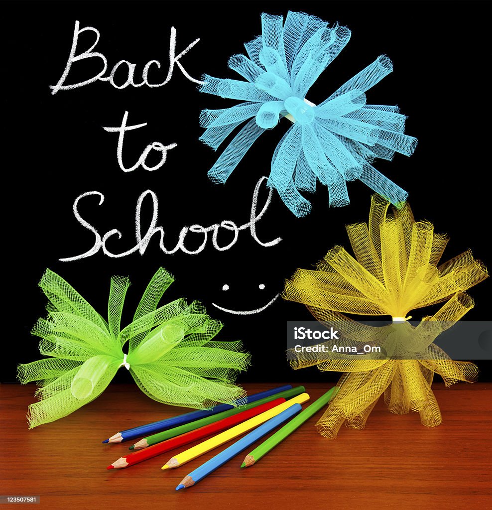 Back to school concept Back to school concept, handwriting on a black chalkboard with colorful objects Anthropomorphic Smiley Face Stock Photo