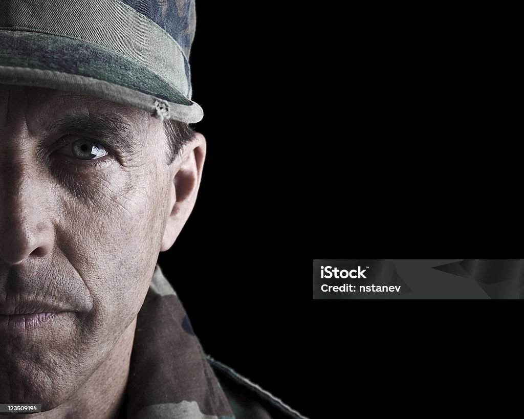 Dramatic Soldier Portrait Dramatic close up portrait of a middle aged army veteran. Armed Forces Stock Photo
