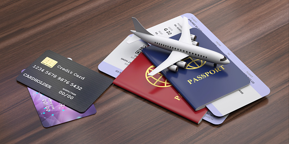 Credit cards and travelling documents on wooden background. Electronic banking, payment for holidays and transportation concept. 3d illustration