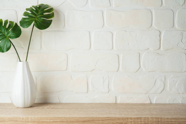 istock Wooden shelf background with home decor vase. 1235111052
