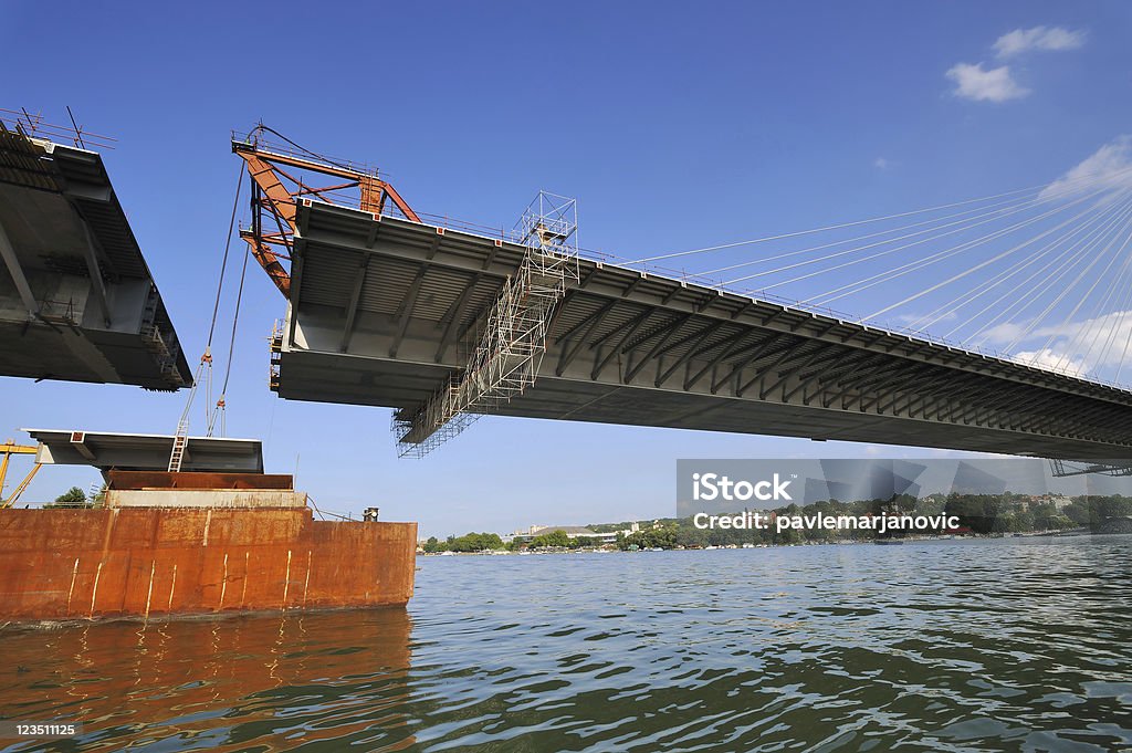 Bridge construction Bridge construction, lifting last segment to the position Ada Township - Michigan Stock Photo