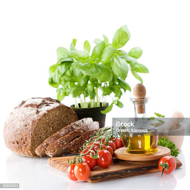 Bread Herbs Olive Oil And Vegetables Stock Photo - Download Image Now - Basil, Bottle, Bread