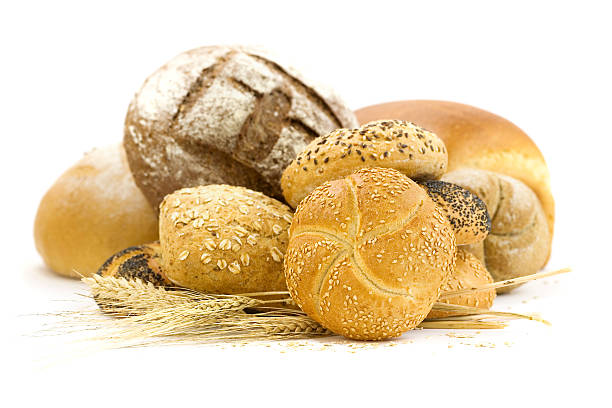 istock An assortment of bread loaves and wheat 123511368