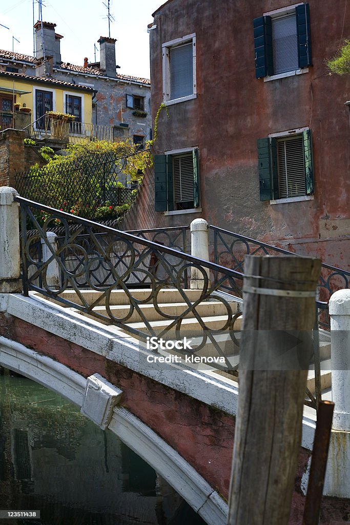Venice. blue and green water of a venetian canal Bridge - Built Structure Stock Photo