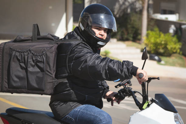istock Man working as motoboy. Delivering with a motorcycle. 1235129225