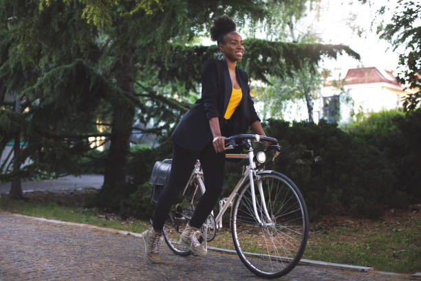 istock Woman in business commuting to work by bicycle 1235148520