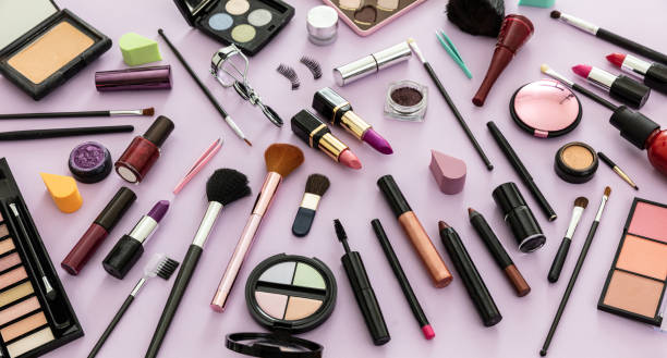 istock Make up cosmetics products against pastel purple background, 1235149727
