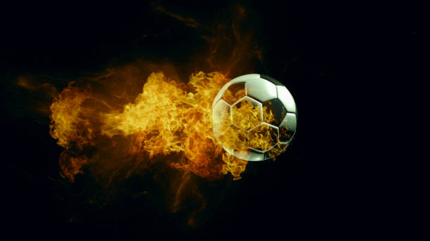 istock soccer ball in fire, isolated dark background. 3d render. 1235158722