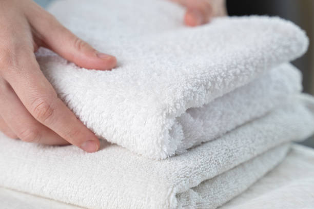 istock A woman touches a fresh white towel 1235162382