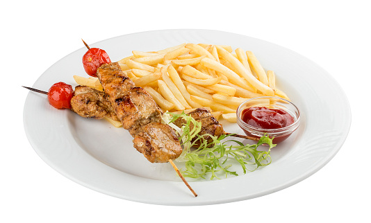 French fries with chicken skewer with red sauce. On white background