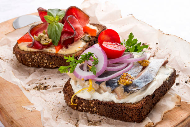 istock Toasts with venison, pepper and capers, herring and ricotta cheese 1235204939