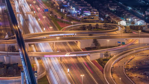 istock Night traffic on a busy intersection on Sheikh Zayed road highway aerial timelapse 1235256795