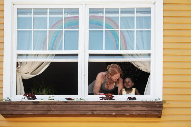 Mature woman gardening with her son, Quebec, Canada