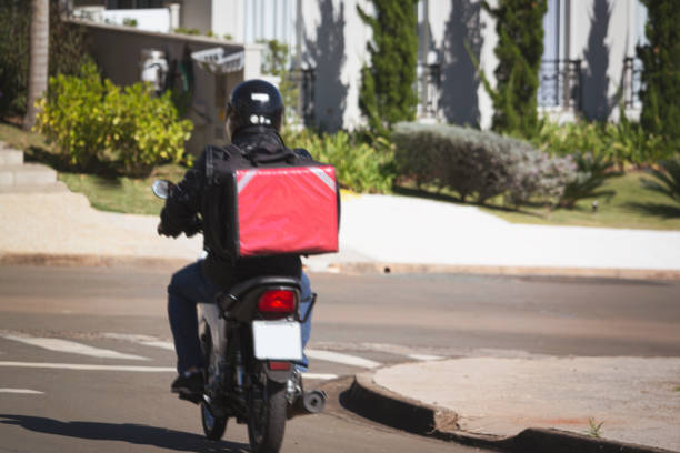 istock Man working as motoboy. Delivering with a motorcycle. 1235284975