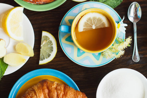 istock Cup with green tea and lemon on the wooden background 1235299598