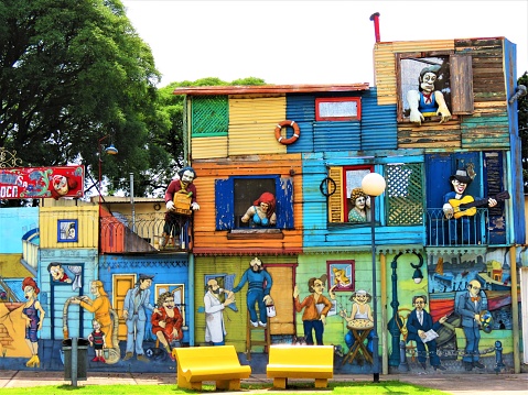 Buenos Aires, Argentina  - January 05 , 2020. La Boca is a very colorful  in Buenos Aires, known for it's many wooden statues and colorful houses.