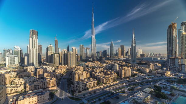 istock Dubai Downtown skyline timelapse with Burj Khalifa and other towers during sunrise paniramic view from the top in Dubai 1235350669