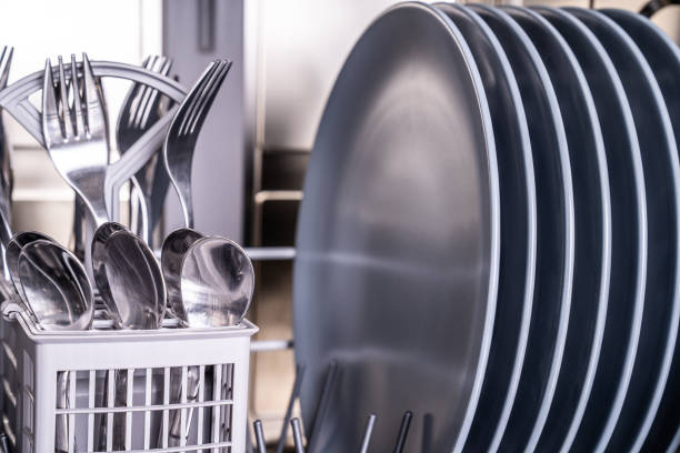 istock Clean plates and shiny silverware in dishwasher 1235367349