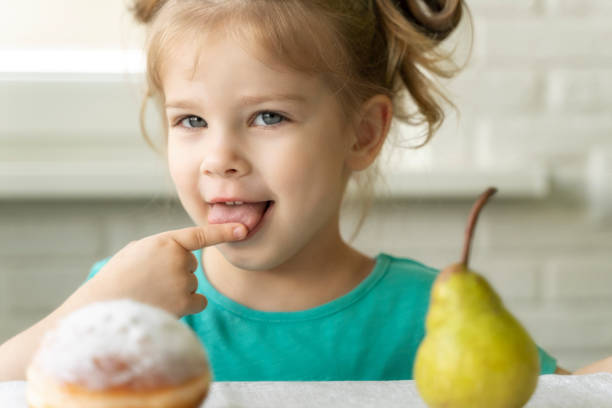 istock child picks meju pear and donut 1235368667