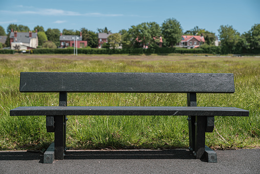 Empty bench in a public playground during lockdown.  Belfast, Northern Ireland.