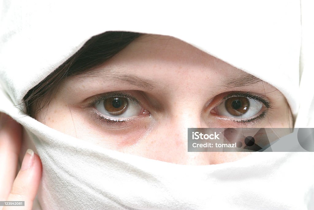 High key covered woman Young woman with muslim tradition clothing. Close-up portrait.  Adult Stock Photo