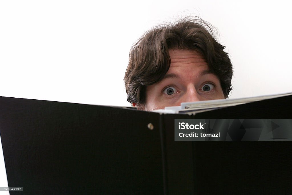 Behind a book Man behind a book. Adult Stock Photo