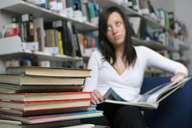 istock Girl in the library 123543003