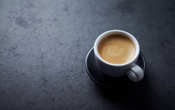 istock Cup of coffee on dark stone background. Copy space 1235454574