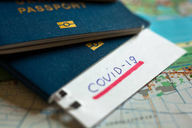 istock Passport and note with Covid-19 inscription. 1235473948