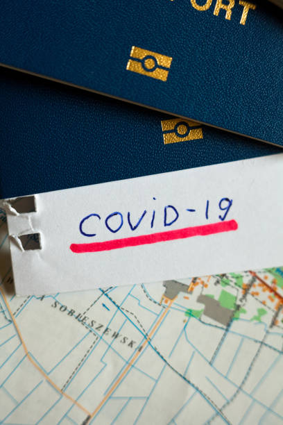 istock Passport and note with Covid-19 inscription. 1235473951
