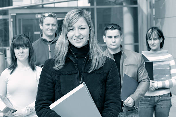 B/W Students Five students in front of a university. Woman in front. noah young stock pictures, royalty-free photos & images