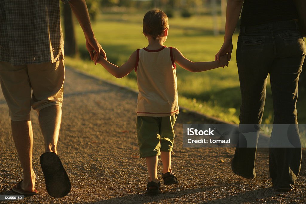 Happy boy Family holding hands. Community Stock Photo