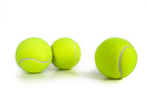 istock Tennis balls isolated on white 1235512246