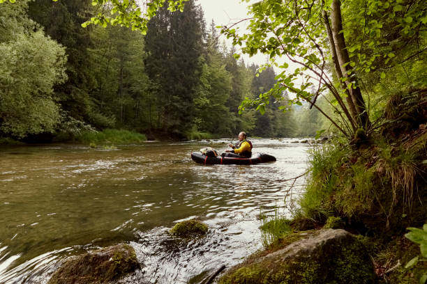 istock Mature man on a boots tour at the river in spring 1235531755