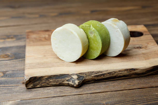 istock Natural handmade round soap bars with different ingredients on a brown wooden background 1235553875