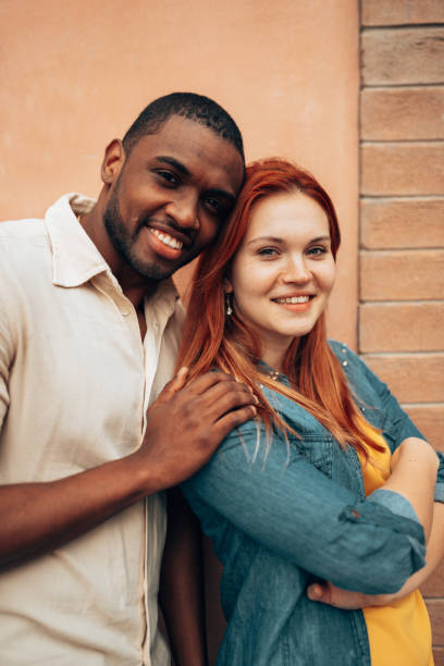 istock interracial couple portrait together 1235555928