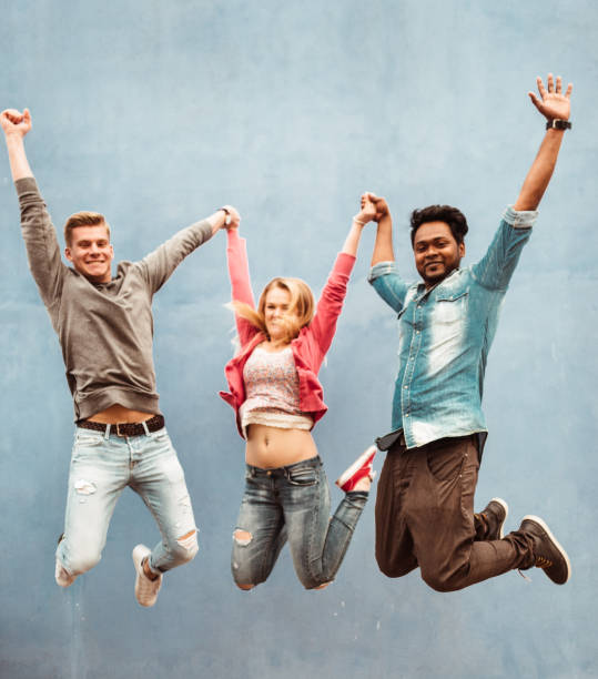 istock happiness friends jumping together 1235580519