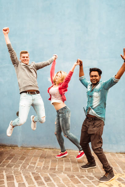 istock happiness friends jumping together 1235581649