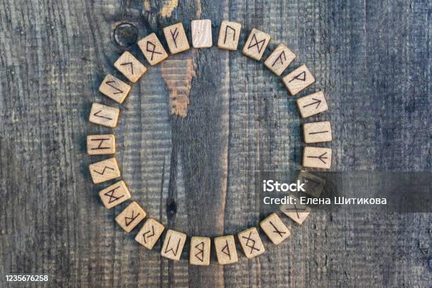 Scandinavian Wooden Runes On An Old Wooden Table Elder Futhark Stock Photo - Download Image Now