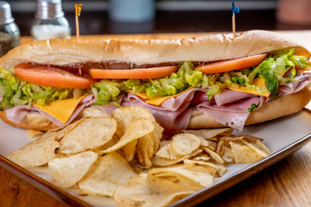 Ham and Cheese Sub hero sandwich Ham and Cheese Sub hero sandwich submarine sandwich photos stock pictures, royalty-free photos & images
