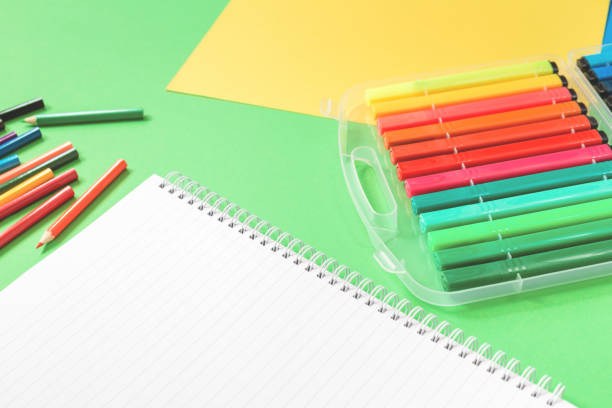 istock Assorted office and school stationery flat lay on green 1235745630