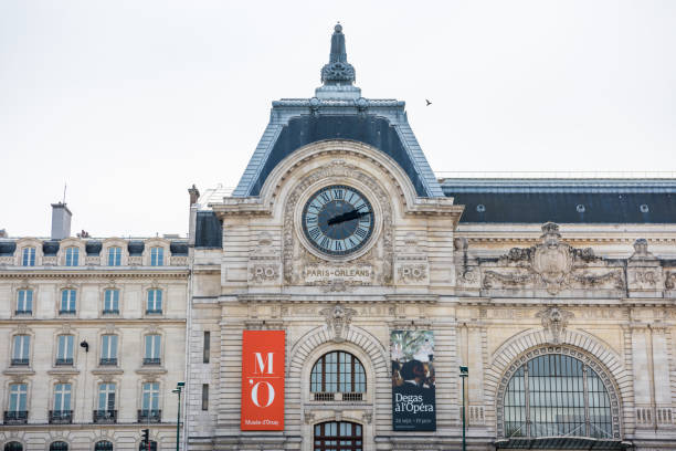 Musee d'Orsay or Orsay museum building Musee d'Orsay or Orsay museum building facade with clock in a cloudy day in Paris, France musee dorsay stock pictures, royalty-free photos & images