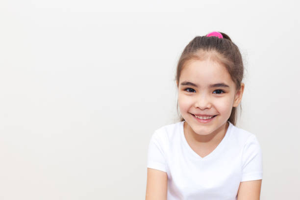 istock Smiling Small Girl Copy Space 1235781705