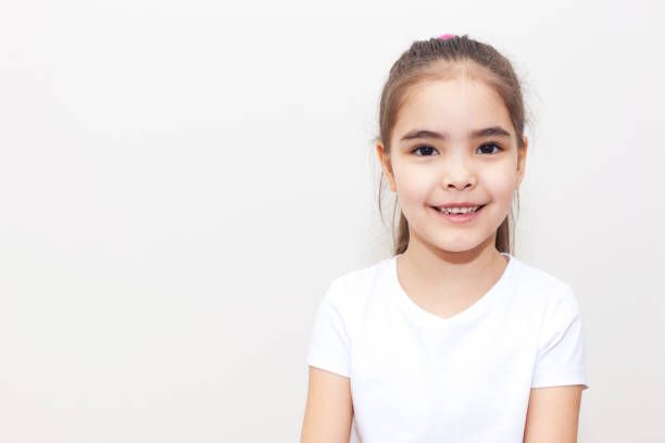 istock Smiling Small Girl White Background 1235781715