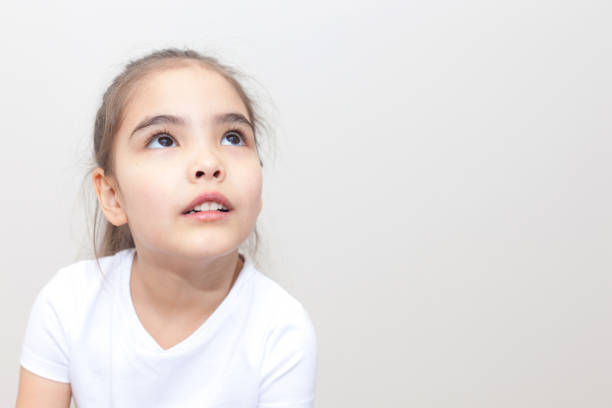istock Dreaming Little Girl Copy Space 1235781717