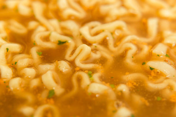 closeup noodle soup with seasoning