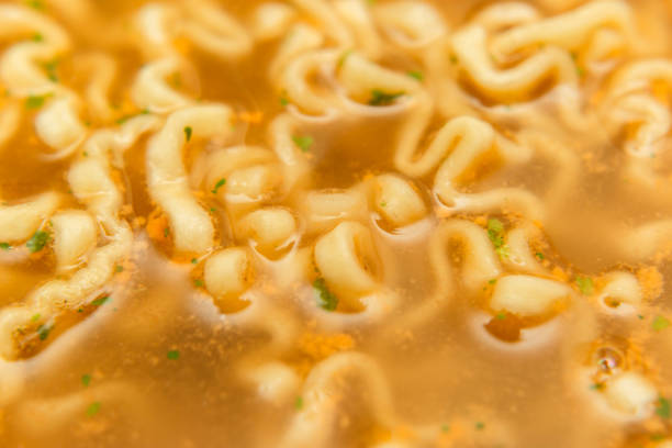 closeup noodle soup with seasoning